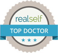Badge representing RealSelf Top Doctor, an accolade for medical professionals recognized for excellence in patient care and positive reviews on the RealSelf platform.